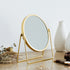 落ち着いたゴールドのフレームと丸形のミラーが目を惹く、卓上ミラー"LINO(リノ)"のLタイプ。
