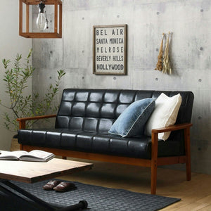 【洗練された大人の空間】モダンなコンクリート壁と温かみのある木製フレームが織りなす、上質なリビングを演出します。